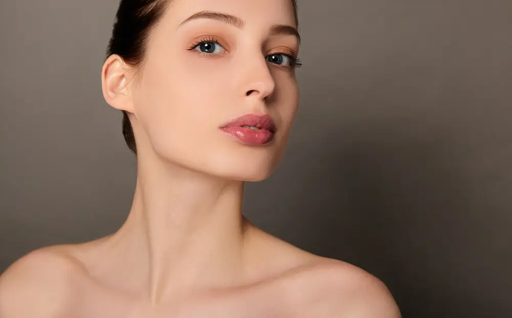 face of a woman looking at the camera