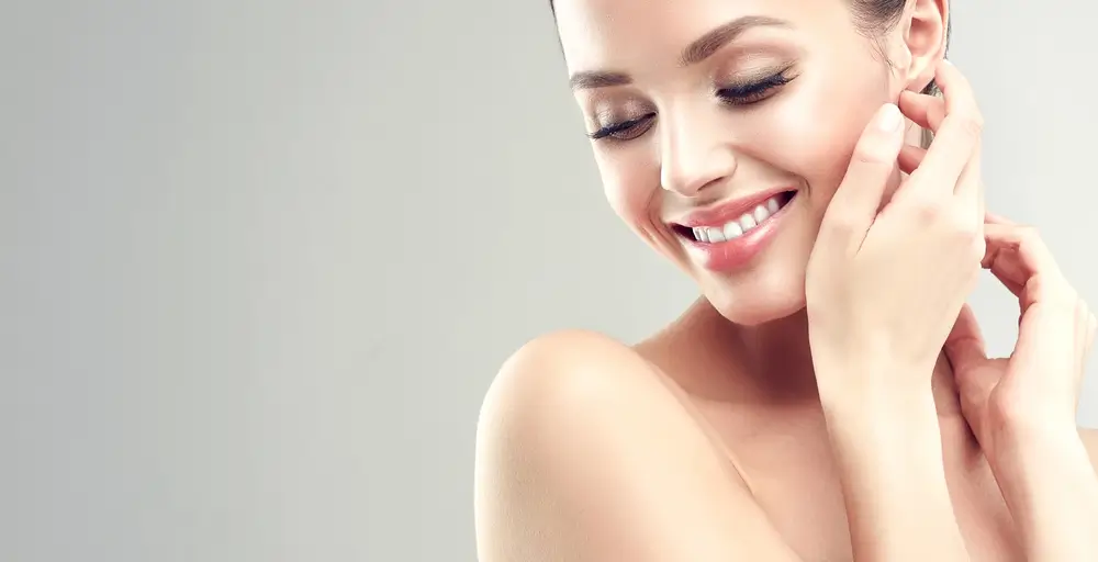 woman touching her face