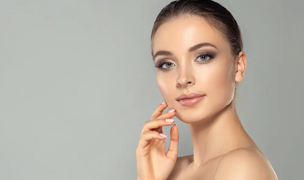 woman touching her face